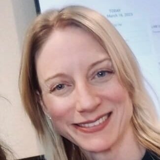 blonde woman smiling.